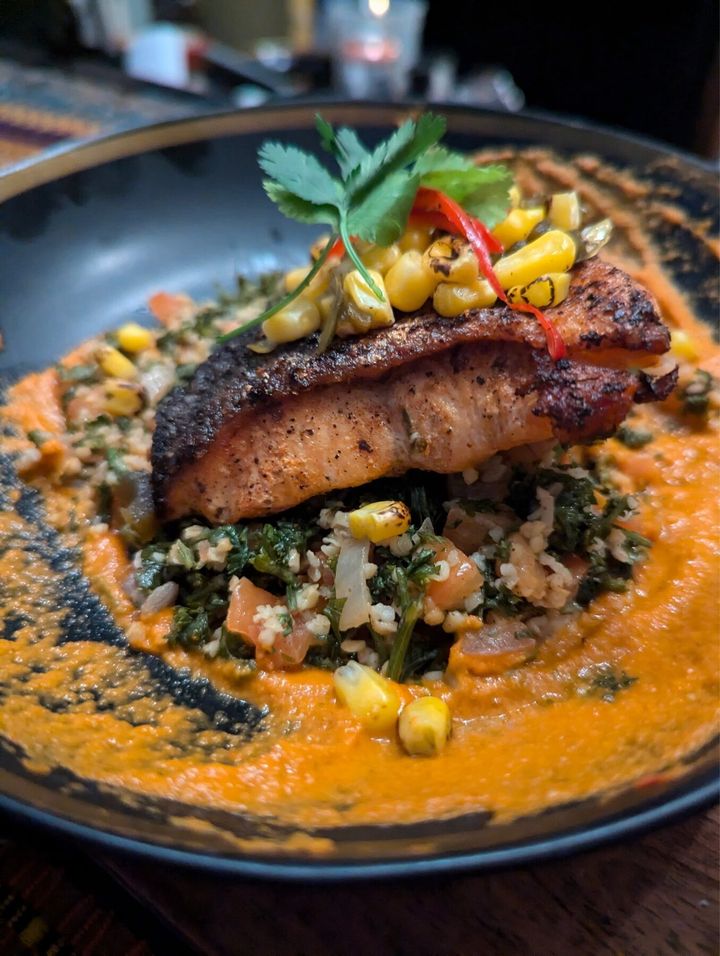 Blackened salmon with charred corn and bulgur plated by Chef Brian Schultze, private chef.