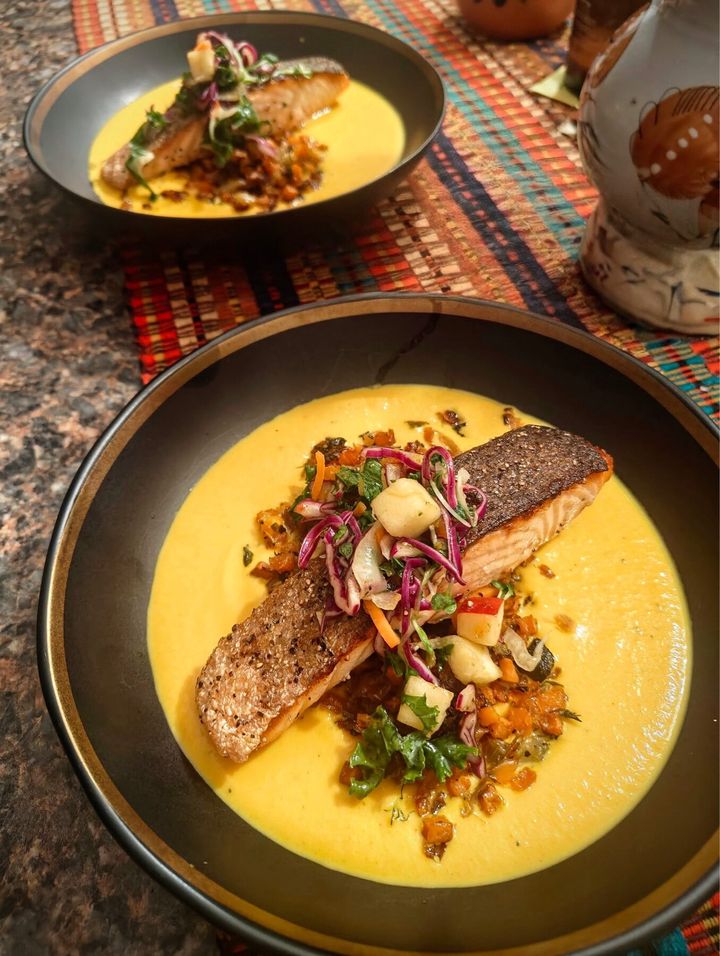 Crispy-skin salmon over saffron puree plated by Chef Brian Schultze, private chef.