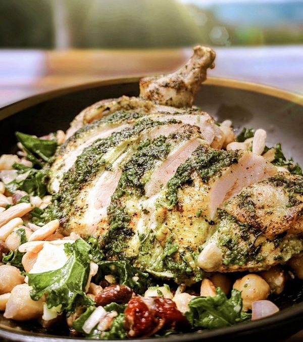 Herb-roasted chicken with kale and chickpeas plated by Chef Brian Schultze, private chef.